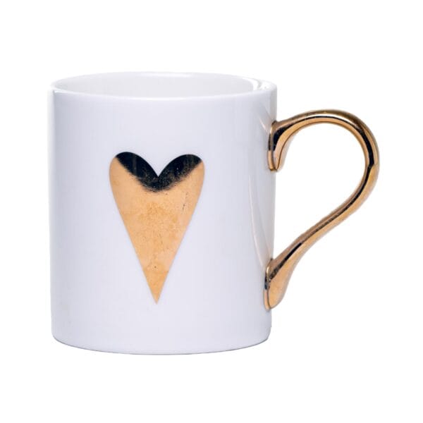 White ceramic mug adorned with a gold handle and a single golden heart